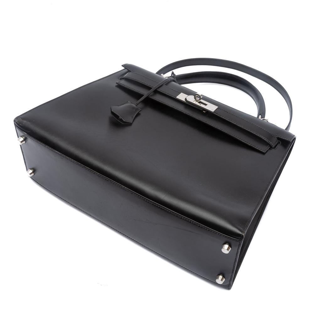 Lot - Hermés Black Box Leather Kelly Retourne 32 Handbag, Date